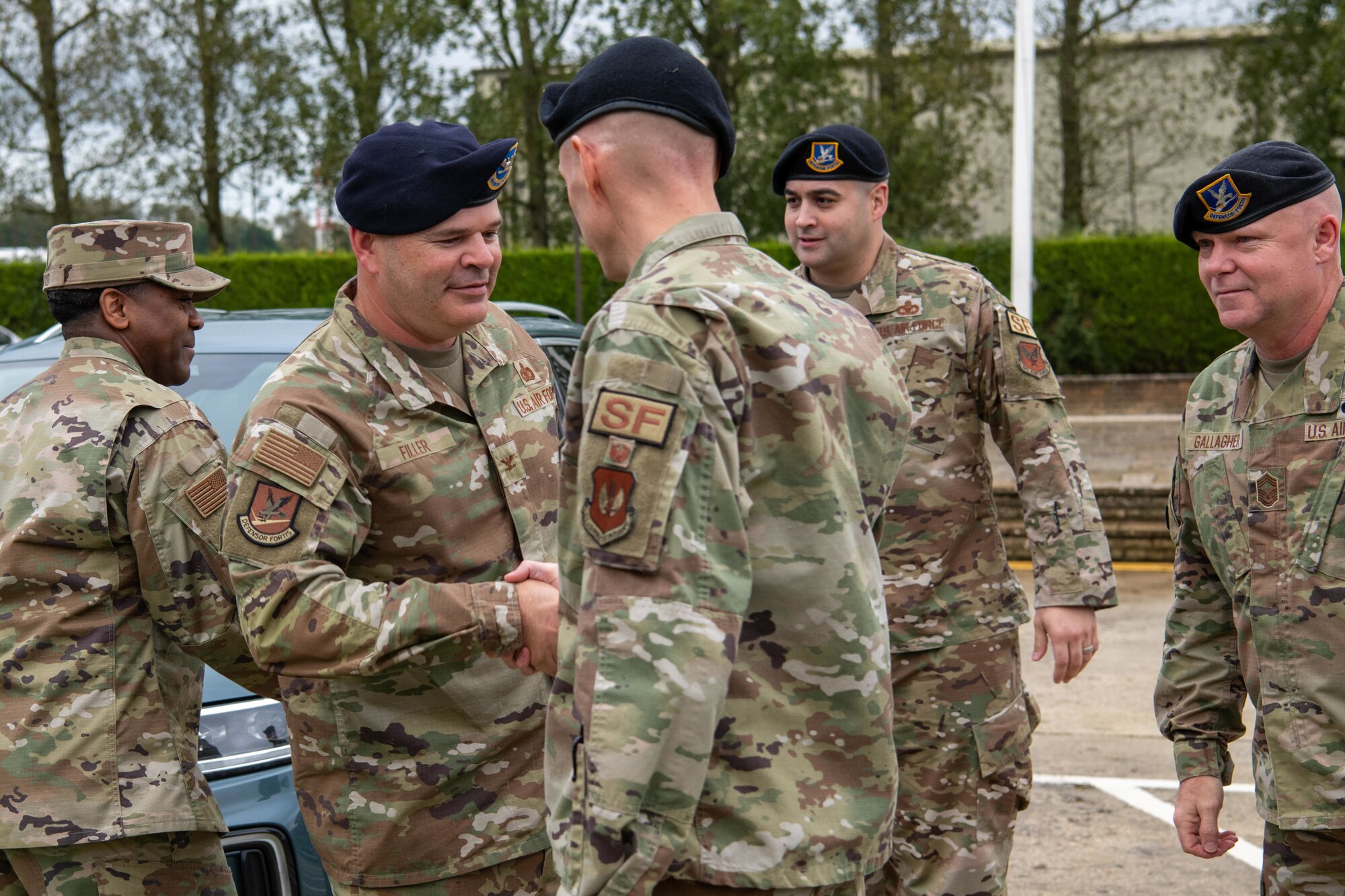 The director of Security Forces greets Airmen