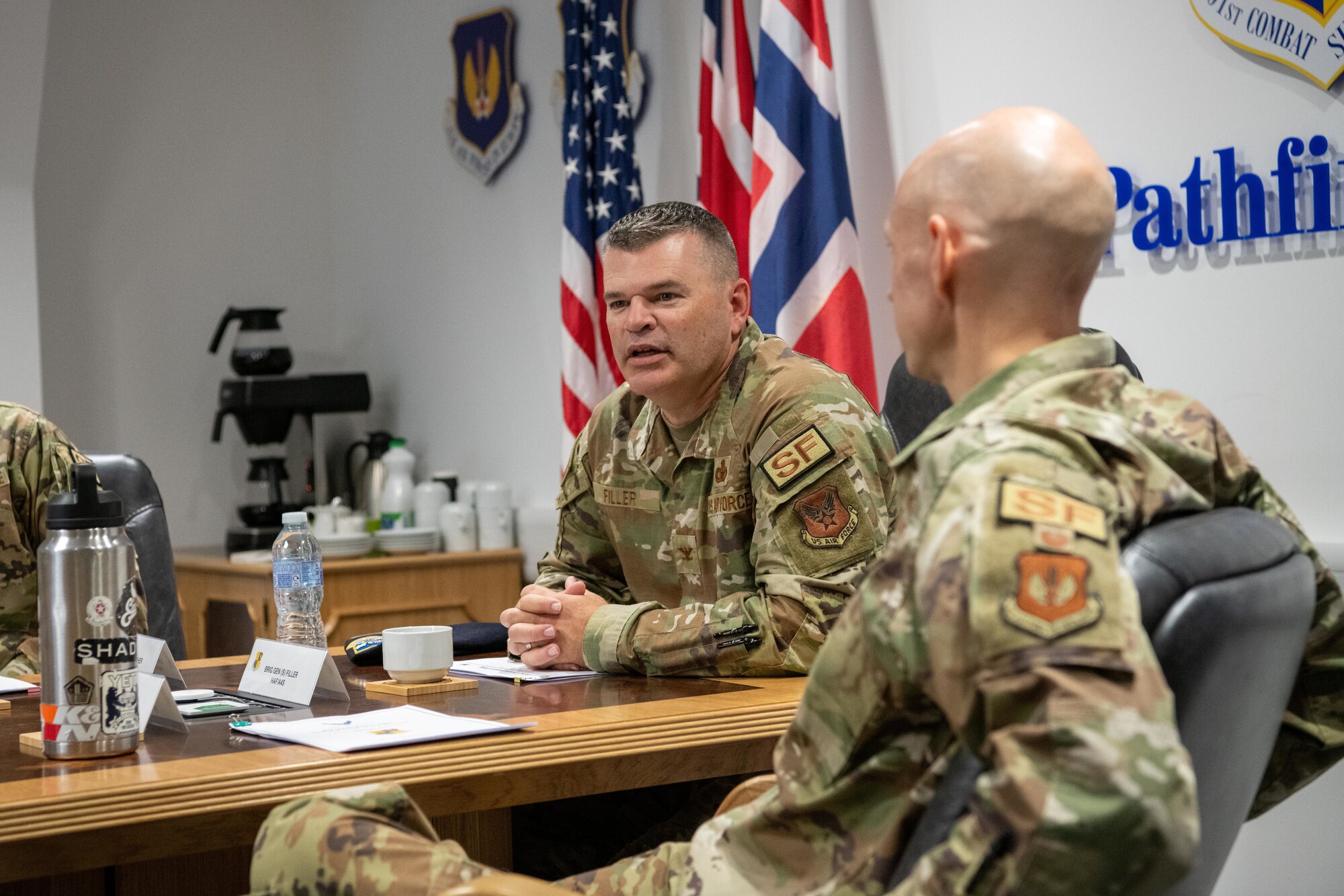 The director of Security Forces gives remarks during a briefing