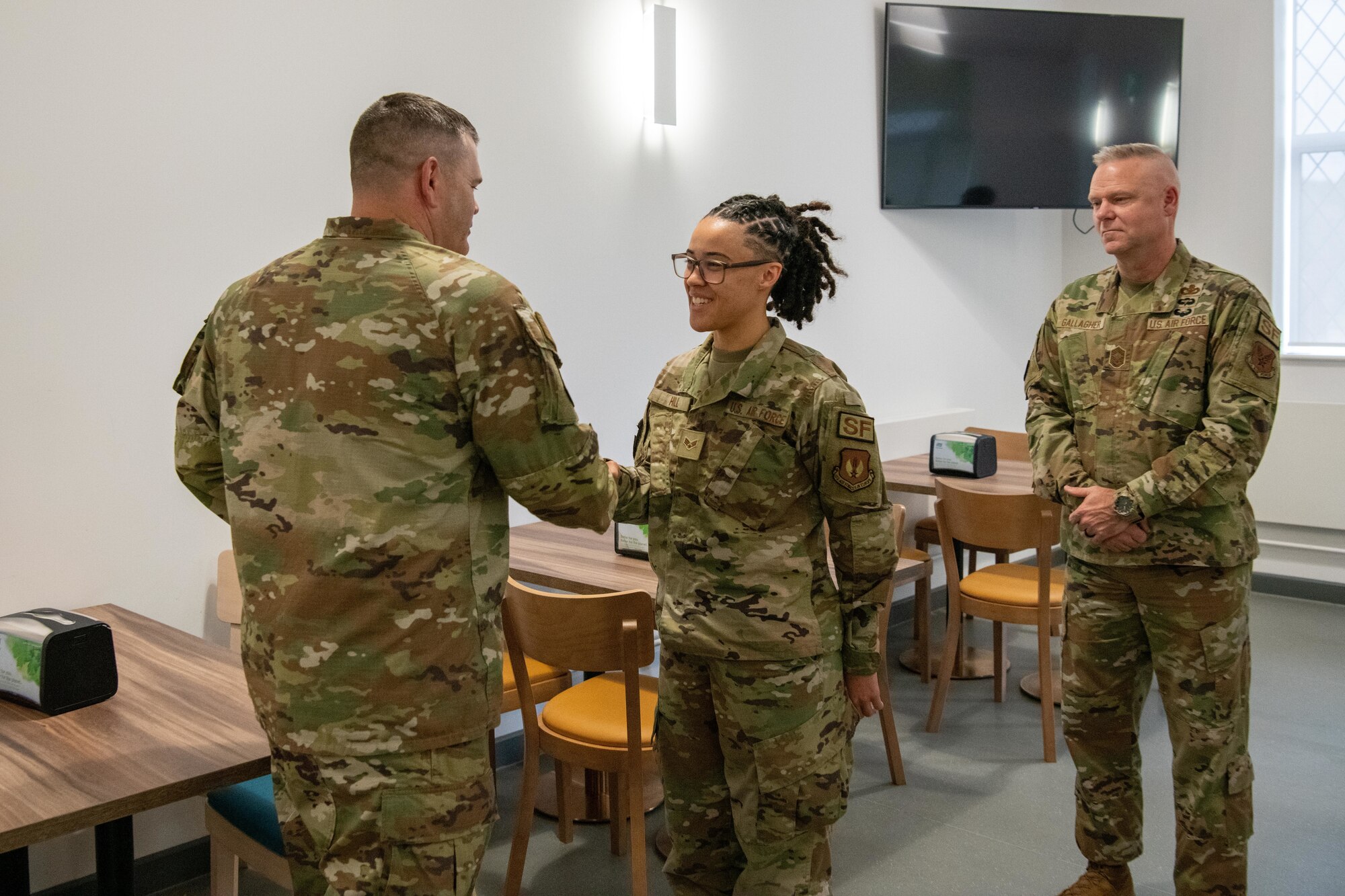 The director of Security Forces recognizes an Airman