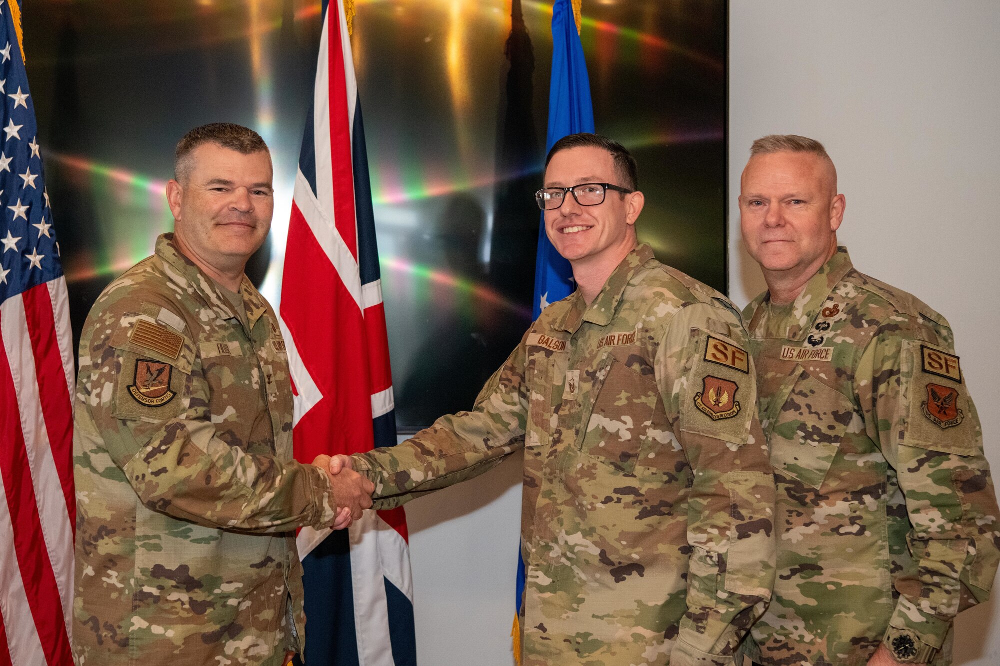 The director of Security Forces recognizes an Airman