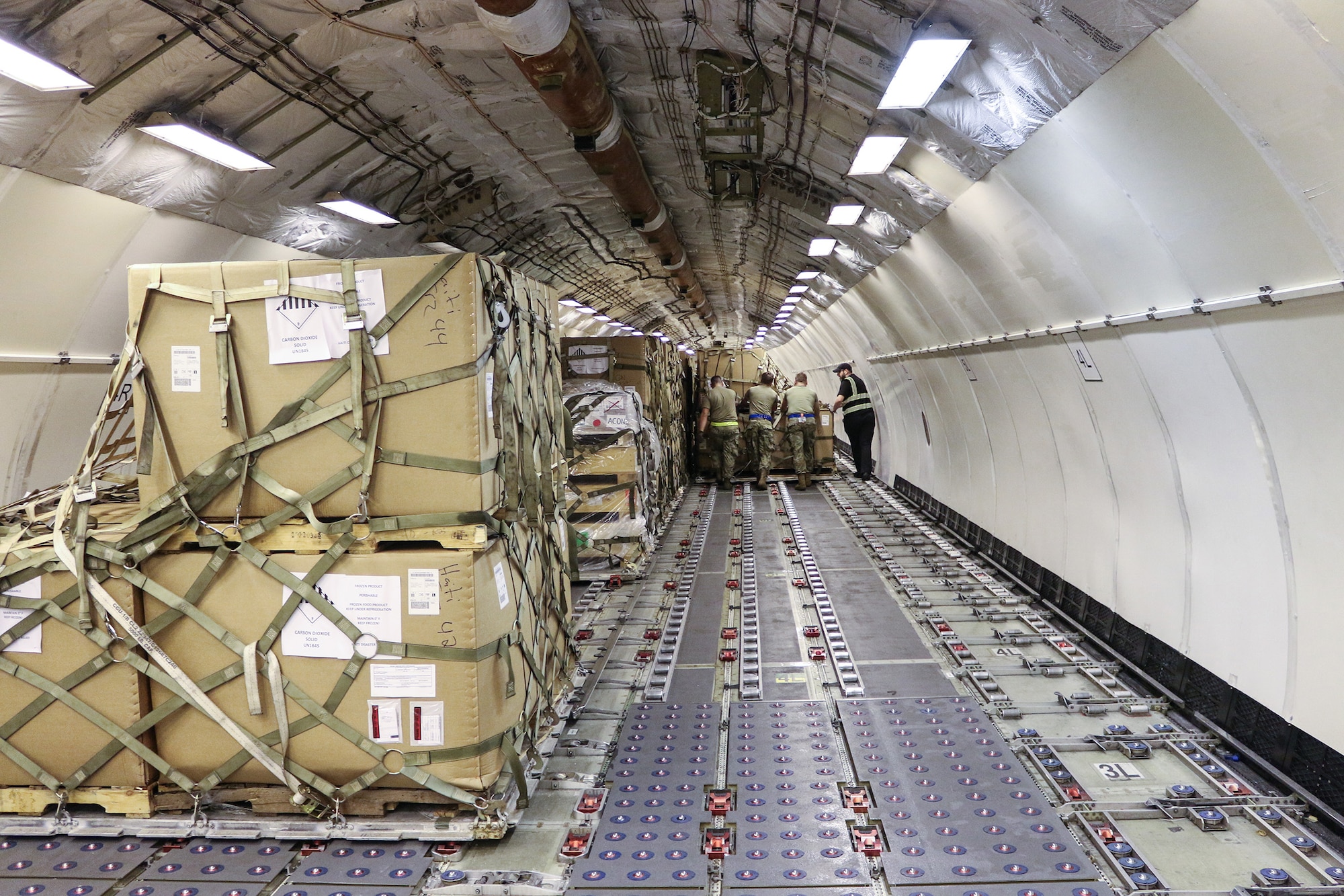 Port Dawgs from the 87th Aerial Port Squadron and the 437th APS load pallets of rations and relief supplies onto an MD-11 cargo plane at Joint Base Charleston, S.C., Aug. 14, 2024. From Aug. 3-17, 2024 while performing annual tour at JB Charleston, 30 Port Dawgs supported missions ranging from hurricane evacuation to international humanitarian relief, and special operations to orientation flights.