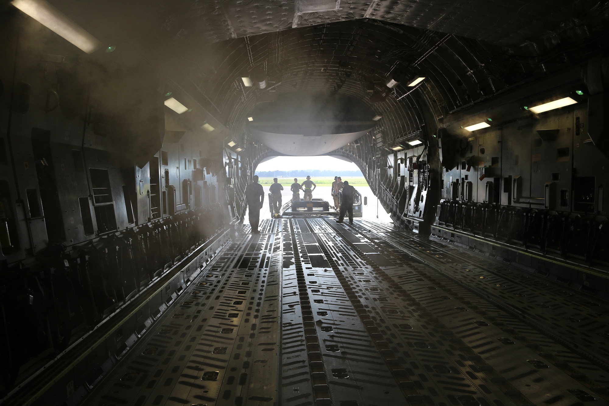Port Dawgs from the 87th Aerial Port Squadron and the 437th APS load pallets of rations and relief supplies onto an MD-11 cargo plane at Joint Base Charleston, S.C., Aug. 14, 2024. From Aug. 3-17, 2024 while performing annual tour at JB Charleston, 30 Port Dawgs supported missions ranging from hurricane evacuation to international humanitarian relief, and special operations to orientation flights.