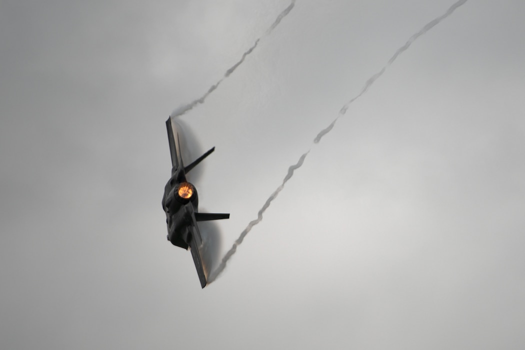 A F-35A Lightning II aircraft flies through the sky,