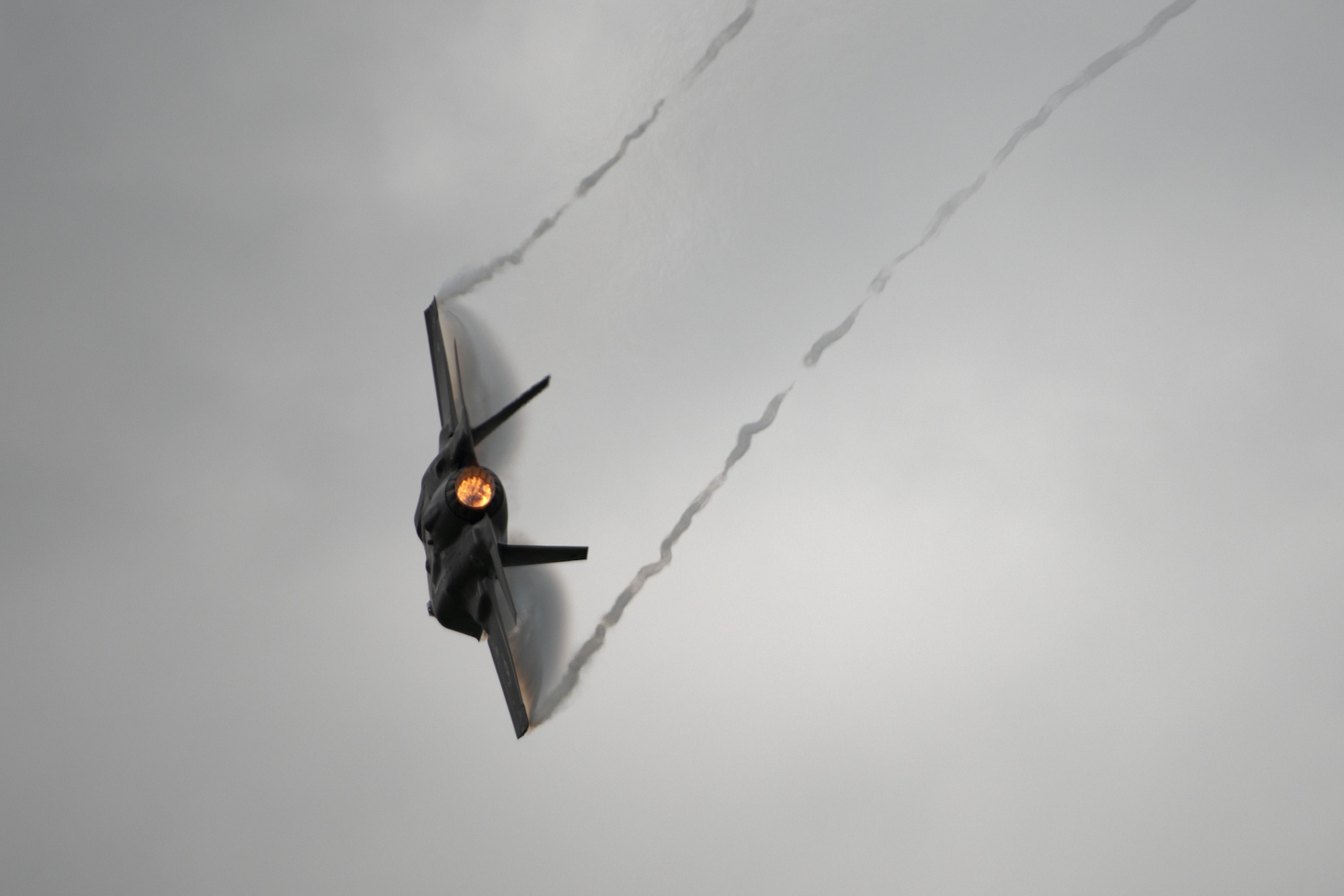A F-35A Lightning II aircraft flies through the sky,
