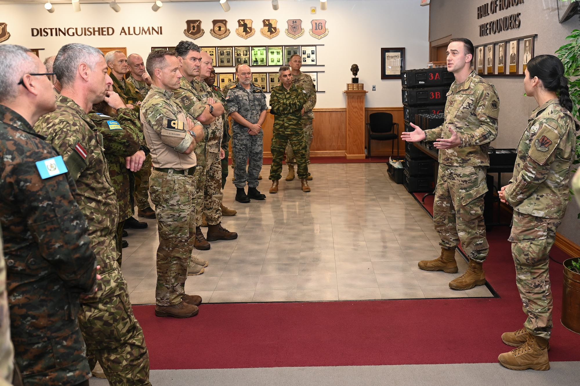 Airman shows intel equipment to Attachés.