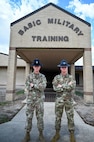 Master Sgt. Christopher Platt, 321st Training Squadron, stands next to his identical twin brother Tech. Sgt. Charles Platt, 320th Training Squadron, Sept. 12, 2024, at Joint Base San Antonio-Lackland, Texas.