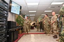 Airman shows intel equipment to Attachés.
