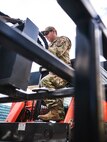 U.S. Air National Guard Technical Sgt. Sccott Darowski, a pavements and construction equipment craftsman from the 134th Civil Engineer Squadron, prepares to unload a front loader from a disaster relief clearing kit in Elizabethton, Tenn., on Oct. 2, 2024.