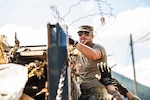 U.S. Air National Guard Senior Master Sgt. Kevin Jackson, a senior leader from the 134th Mission Support Squadron helps clear debris with Airmen from the 134th Civil Engineer Squadron, in Elizabethton, Tenn., Oct. 2, 2024. Airmen commuted to Elizabethton and surrounding areas daily to help clear debris and give assistance to local residents in need due to flooding from Hurricane Helene.