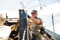 U.S. Air National Guard Senior Master Sgt. Kevin Jackson, a senior leader from the 134th Mission Support Squadron helps clear debris with Airmen from the 134th Civil Engineer Squadron, in Elizabethton, Tenn., Oct. 2, 2024.