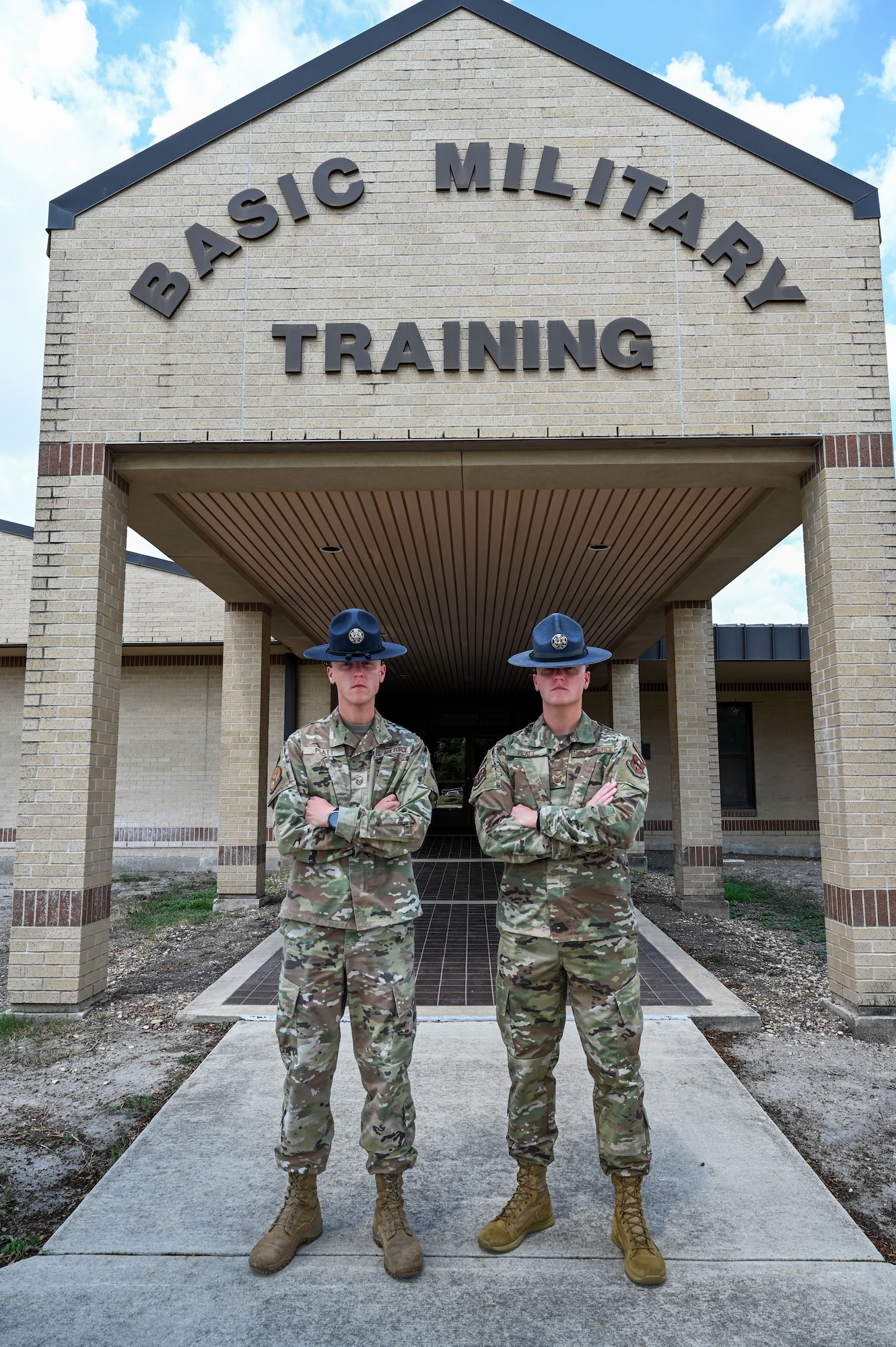 Master Sgt. Christopher Platt, 321st Training Squadron, stands next to his identical twin brother Tech. Sgt. Charles Platt, 320th Training Squadron, Sept. 12, 2024, at Joint Base San Antonio-Lackland, Texas. The brothers pursued a career in the Air Force together – from enlisting together to completing Basic Military together – until now, where both are assigned to the 737th Training Group. The brothers share more than similar looks, they also share a goal of inspiring young Airmen. “As long as I can make a change in a few people, that’s all that matters,” Charles said. The 737 TRG is aligned under the 37th Training Wing. (U.S. Air Force photo by Vanessa R. Adame)