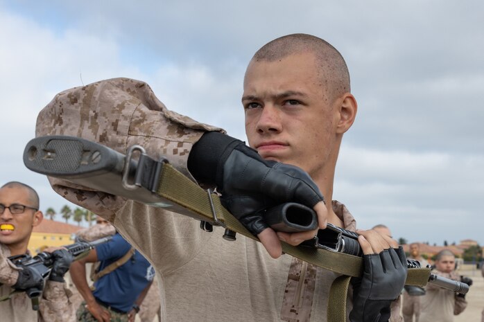 U.S. Marine Corps Recruit Joshua Petts, with Kilo Company, 3rd Recruit Training Battalion, executes a horizontal buttstroke bayonet technique at Marine Corps Recruit Depot San Diego, California, Sept. 25, 2024. Bayonet techniques tie into the Marine Corps Martial Arts Program and strengthens the mental and moral resiliency of individual recruits and Marines through realistic combative training, warrior ethos studies, and physical hardening. (U.S. Marine Corps photo by Lance Cpl. Janell B. Alvarez)