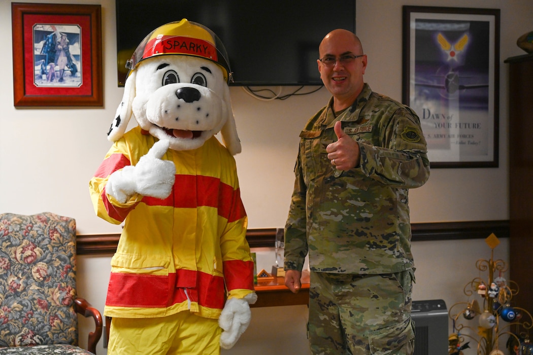 Col. Imme and Spark point a thumbs up at the camera.