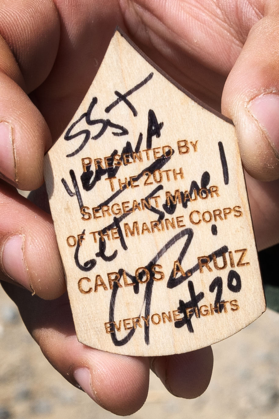 U.S. Marine Corps Staff Sgt. Aaron Yerena, a Marine Combat Instructor with School of Infantry-West, holds a challenge coin presented by Sgt. Maj. Carlos A. Ruiz, Sergeant Major of the Marine Corps, at Marine Corps Installations West Marine Corps Base Camp Pendleton, Calif., Aug. 26, 2024. Sgt. Maj. Ruiz toured MCB Camp Pendleton, interacted personally with Marines, and emphasized the Barracks 2030 plan to improve Marines’ welfare through barracks modernization. (U.S. Marine Corps photo by Lance Cpl. Jeslianne A. Torres)