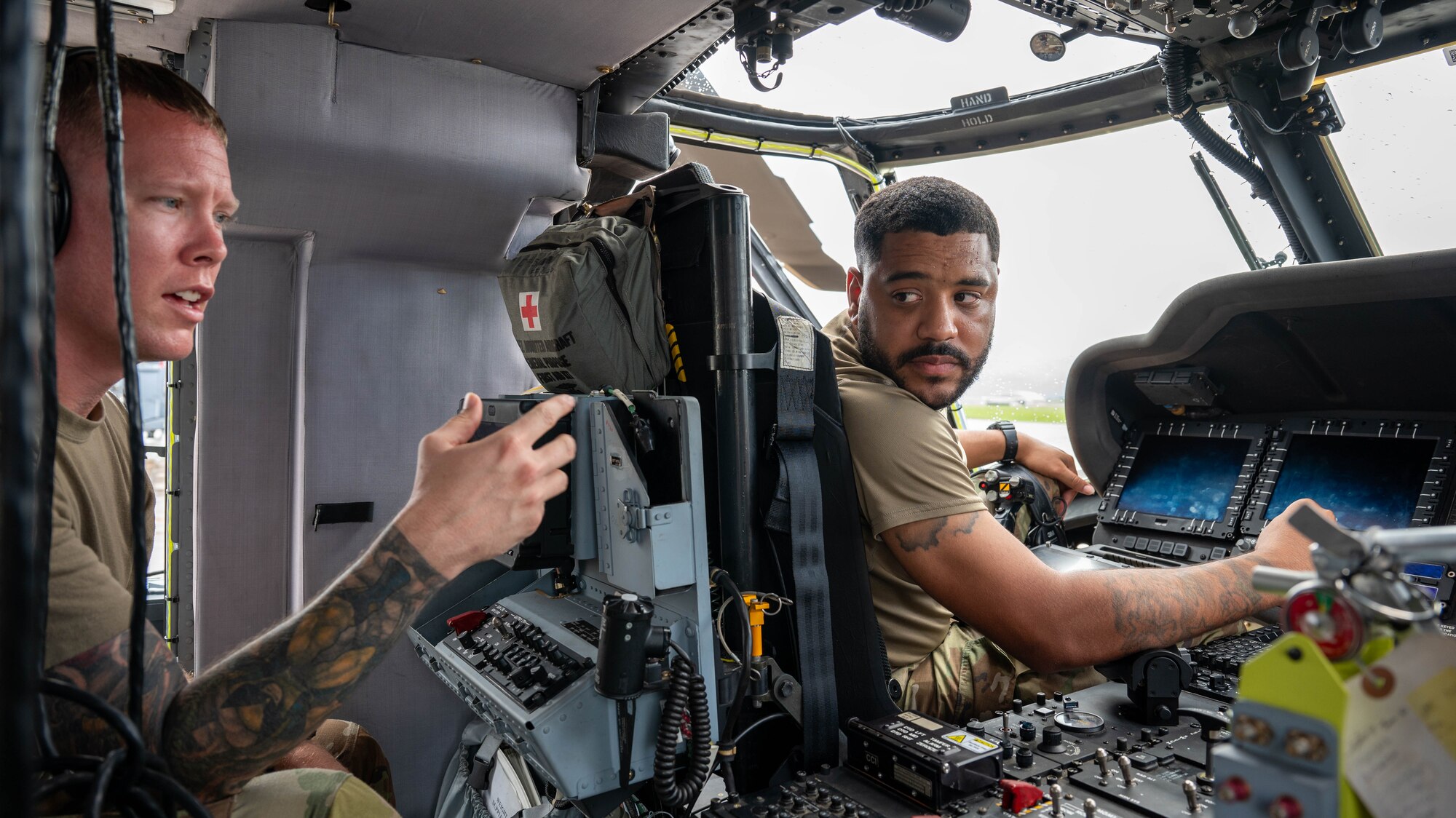 U.S. Air Force Tech Sgt. Douglas Wheeler instructs Airmen from the 721st on the equipment in a HH-60W