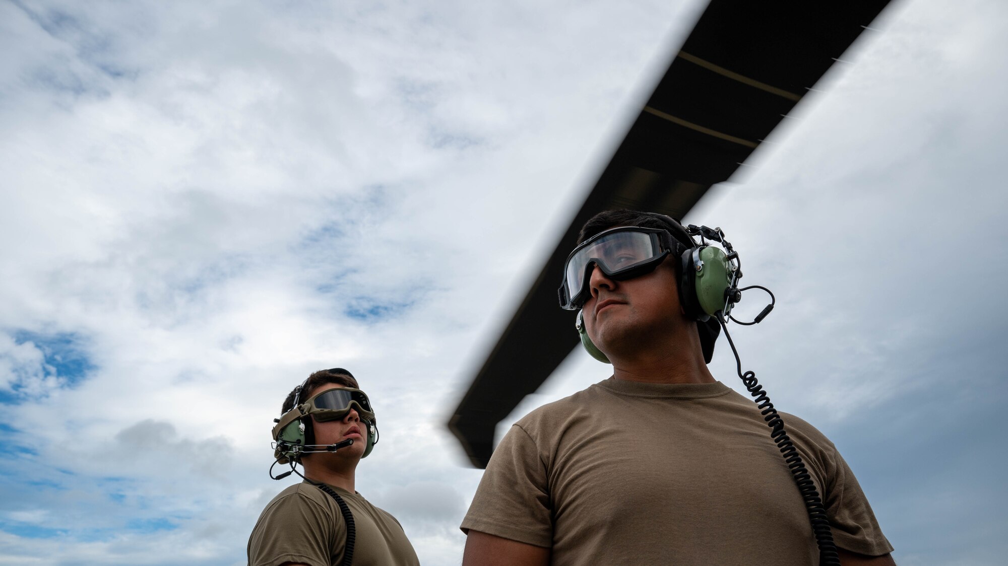Airmen with the 72st stand by as a HH-60W prepares for take off