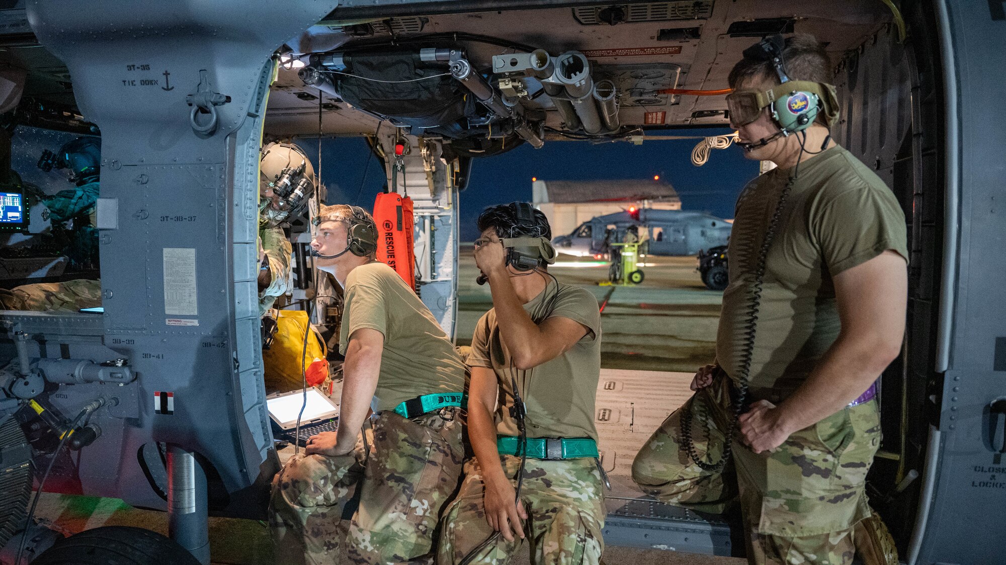 members from the 721st stand by as a hydrolic issue is diagnosed
