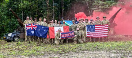 A team of joint multinational service members poses for a photo during operation Render Safe, Munda, Solomon Islands, Sept. 13, 2024.