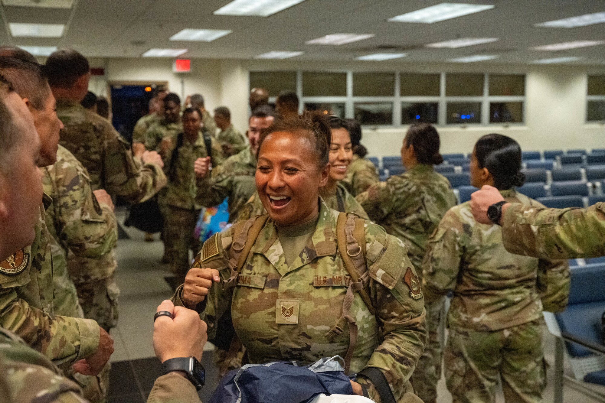 U.S. Air Force service members are greeted upon with a fist bump.