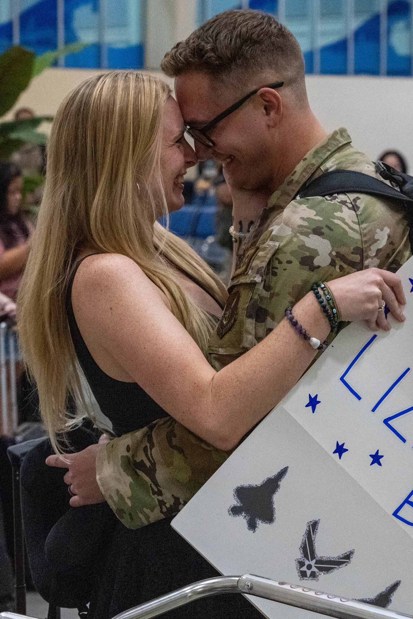 A U.S. Air Force Airman is greeted by a loved one.