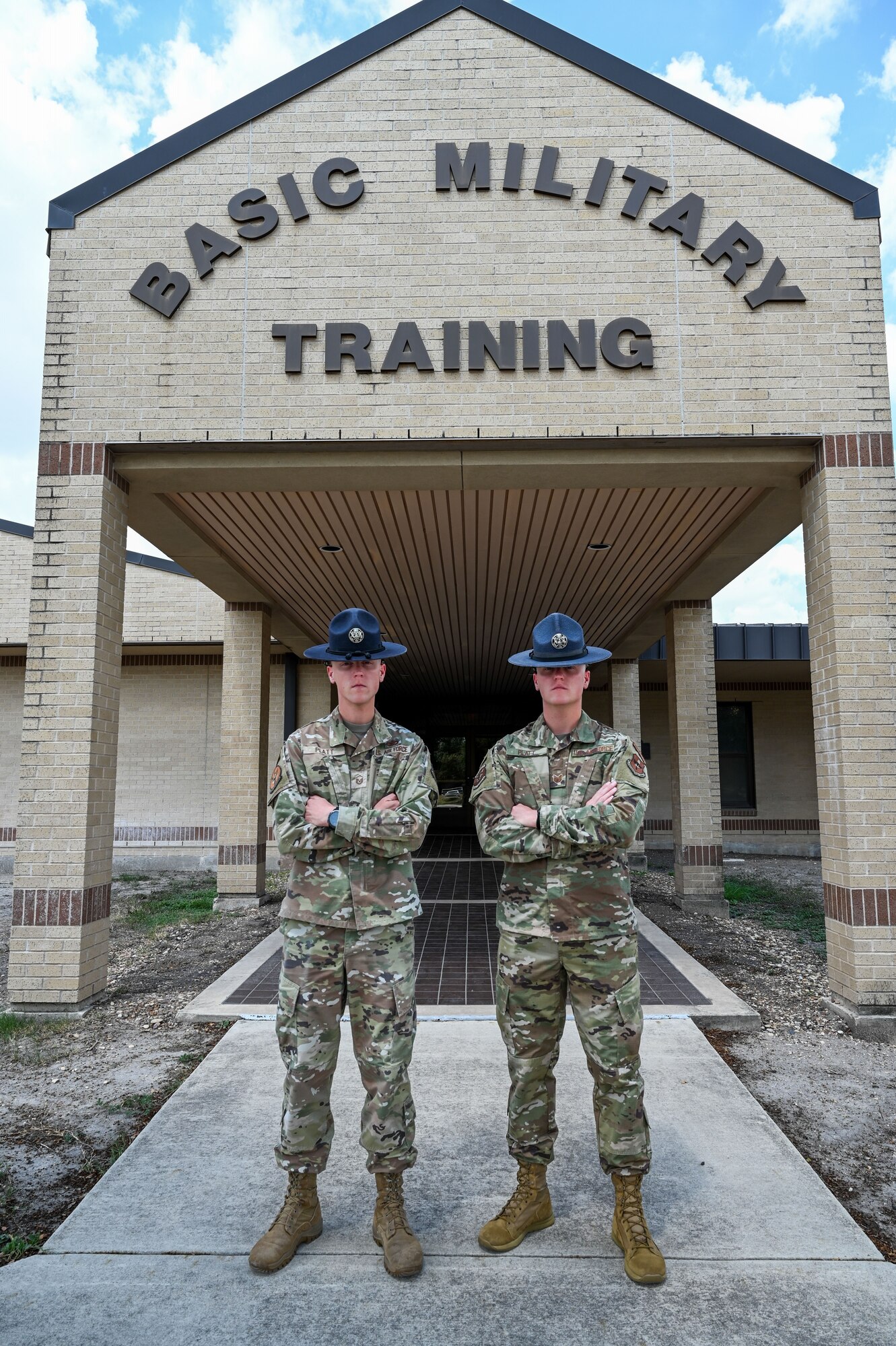 Master Sgt. Christopher Platt, 321st Training Squadron, stands next to his identical twin brother Tech. Sgt. Charles Platt, 320th Training Squadron, Sept. 12, 2024, at Joint Base San Antonio-Lackland, Texas. The brothers pursued a career in the Air Force together – from enlisting together to completing Basic Military together – until now, where both are assigned to the 737th Training Group. The brothers share more than similar looks, they also share a goal of inspiring young Airmen. “As long as I can make a change in a few people, that’s all that matters,” Charles said. The 737 TRG is aligned under the 37th Training Wing. (U.S. Air Force photo by Vanessa R. Adame)