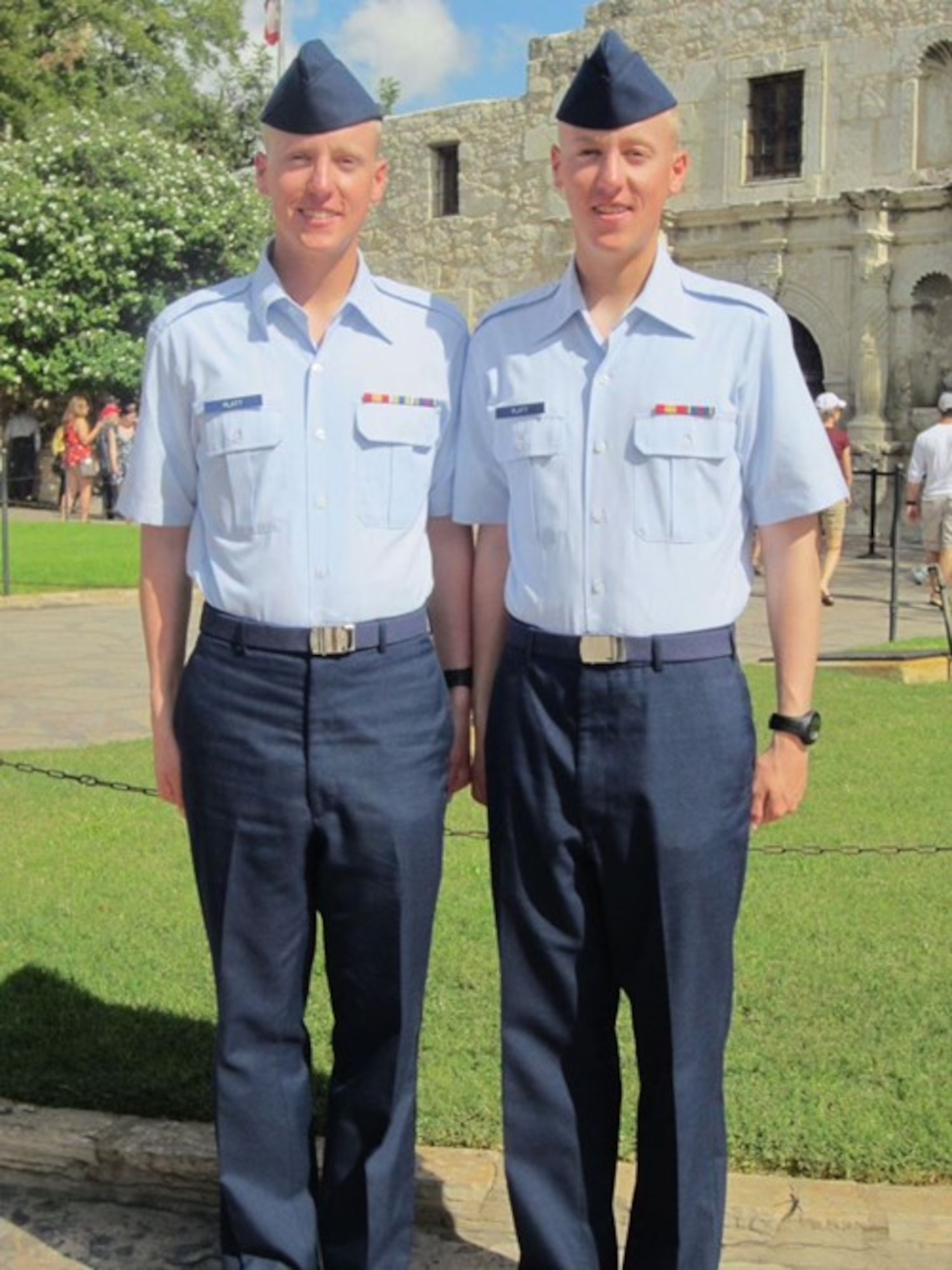 Charles Platt (left) and Christopher Platt stand in front of The Alamo after graduating from Basic Military Training Nov.12, 2012, in San Antonio, Texas. The identical twins pursued a career in the Air Force together – from enlisting together to completing Basic Military together – until now, where both are assigned to the 737th Training Group.
