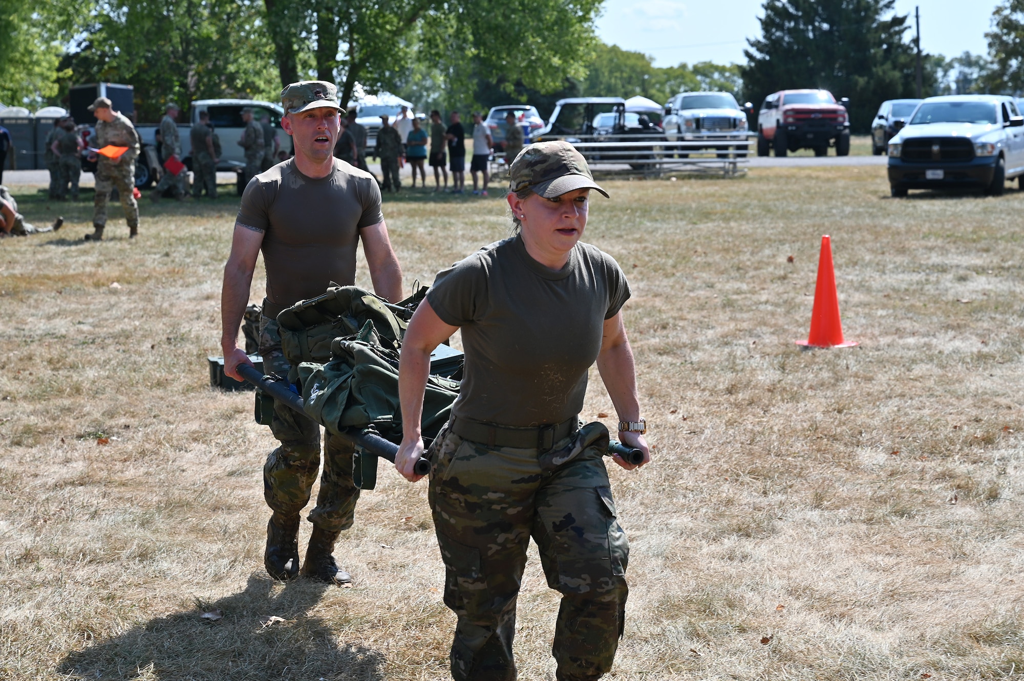 Maj. Robert Cost II, 445th AW director, Inspector General inspections, and Master Sgt. Stephanie Koth, IGI inspector, participate in the litter carry. Airmen with the 445th Airlift Wing participated in the wing’s first Command Chief’s Challenge, Sept. 14, 2024. The challenge is an esprit de corps event showcasing the physical resiliency and capabilities of 445th AW Airmen.