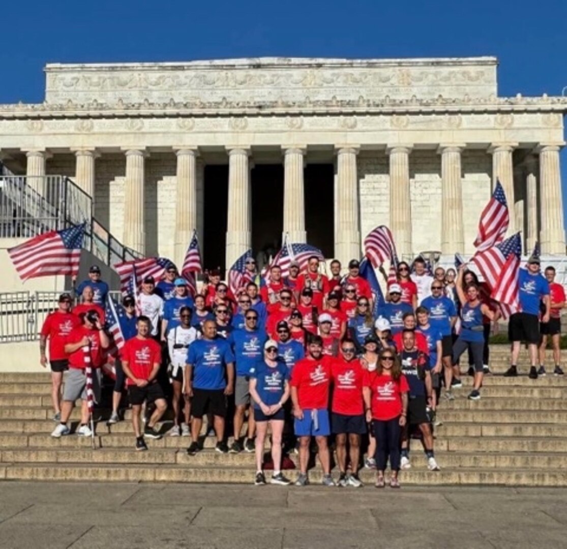 Members of the Old Town Run Club gather for a group photo at the Lincoln Memorial during the group’s inaugural “Pentagon to Ground Zero Run,”
