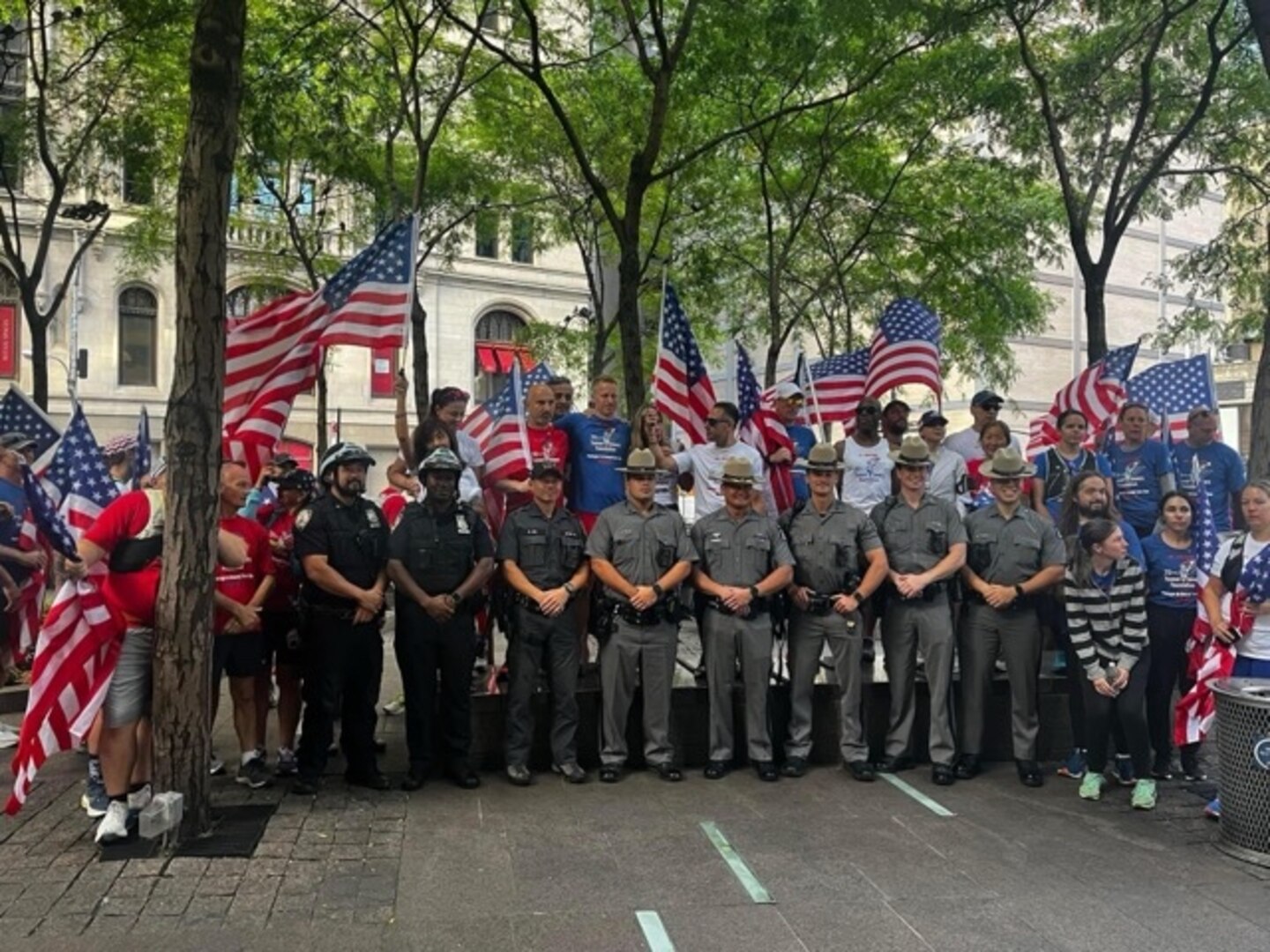 Members of the Old Town Run Club gather for a group photo with first responders during the group’s inaugural “Pentagon to Ground Zero Run,”