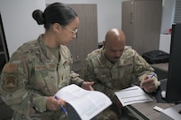 two people working on paperwork