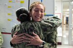 Petty Officer First Class Emily Page, left, embraces Petty Officer Second Class Vanessa Schofield after pinning her new rank upon her during a ceremony celebrating her meritorious advancement Tuesday, October 1, 2024 aboard Naval Health Clinic Cherry Point.  Both Scofield and Page received meritorious promotions during the surprise ceremony.