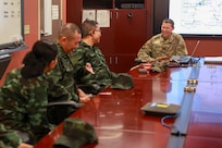U.S. Army Lt. Col. Keith Kosik, Washington National Guard State Partnership Program director and Lt. Col. Joel Johnson, Washington bilateral affairs officer, Thailand, deliver an introduction to the Washington Military Department to members of the Royal Thai Army during a humanitarian aid and disaster relief subject matter expert exchange on Camp Murray, Wash., Sept. 24, 2024.