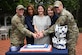 Joint Base Andrews Fisher House supporters prepare to cut the ceremonial cake during the 30th anniversary event of the Fisher House, Joint Base Andrews, Md., Sept. 26, 2024. The event celebrated three decades of unwavering support to military families, highlighting the Fisher House's mission of providing a 