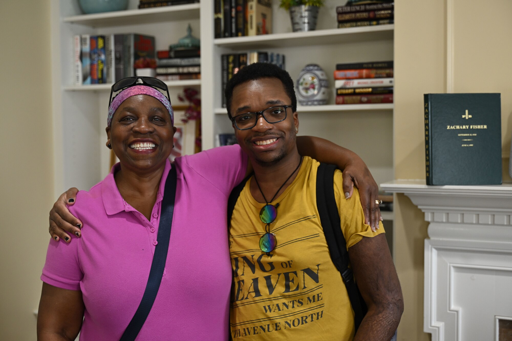 Retired U.S. Air Force Master Sgt. Mary Williams, left, and her son, Harry Williams III, take a group photo during a tour of the Fisher House, Joint Base Andrews, Md., Sept. 26, 2024. The Williams family stayed at the Fisher House from December 1999 to May 2000 while her son received care at Walter Reed National Military Medical Center. (U.S. Air Force photo by Airman 1st Class Gianluca Ciccopiedi)