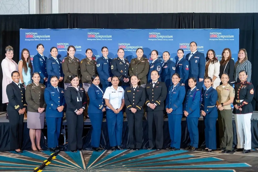 Master Sgt. Alejandra M. Long (back row, eighth from left), senior human resources noncommissioned officer for the 213th Regional Support Group, was among the service members who received a 2024 Distinguished Military Service Award Recipient from Latina Style Inc. The awards were presented during the 21st National Latina Symposium on Sept. 19 in Arlington, Virginia. (Photo courtesy of Latina Style Inc.)