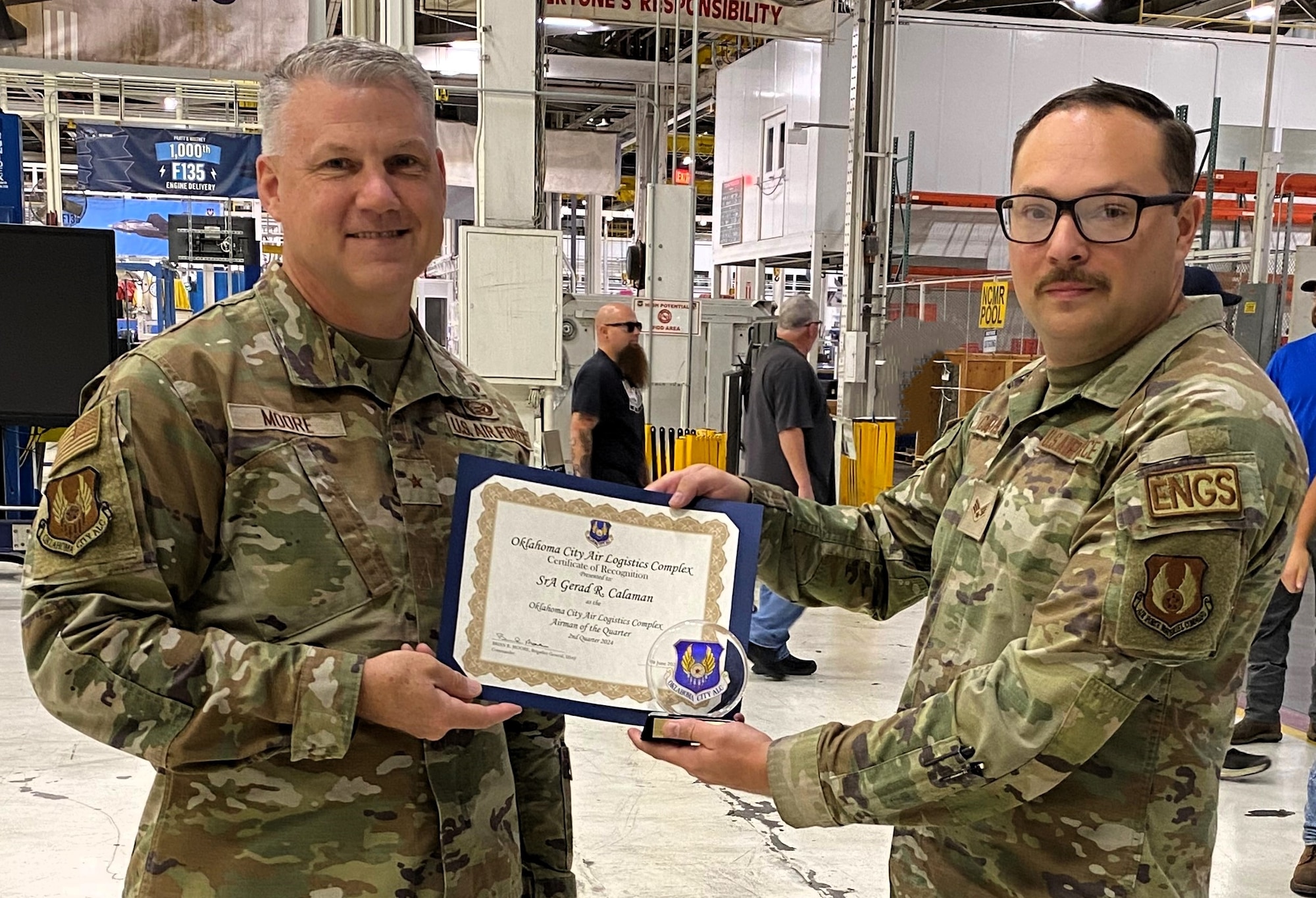 Two men holding a certificate