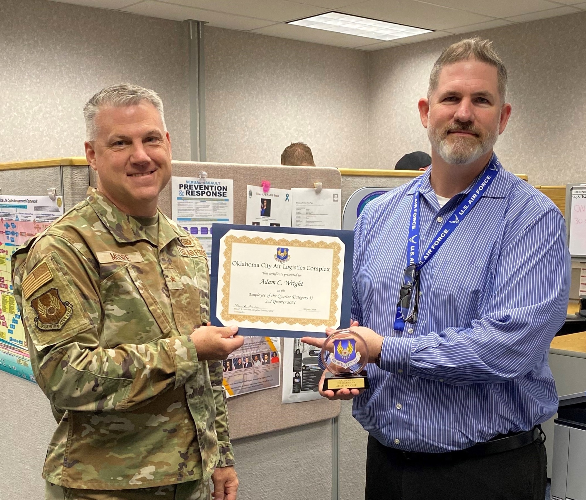 Two men holding a certificate