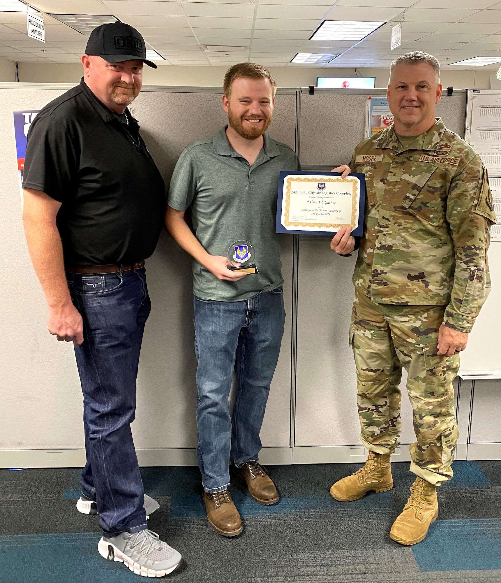 Two men holding a certificate