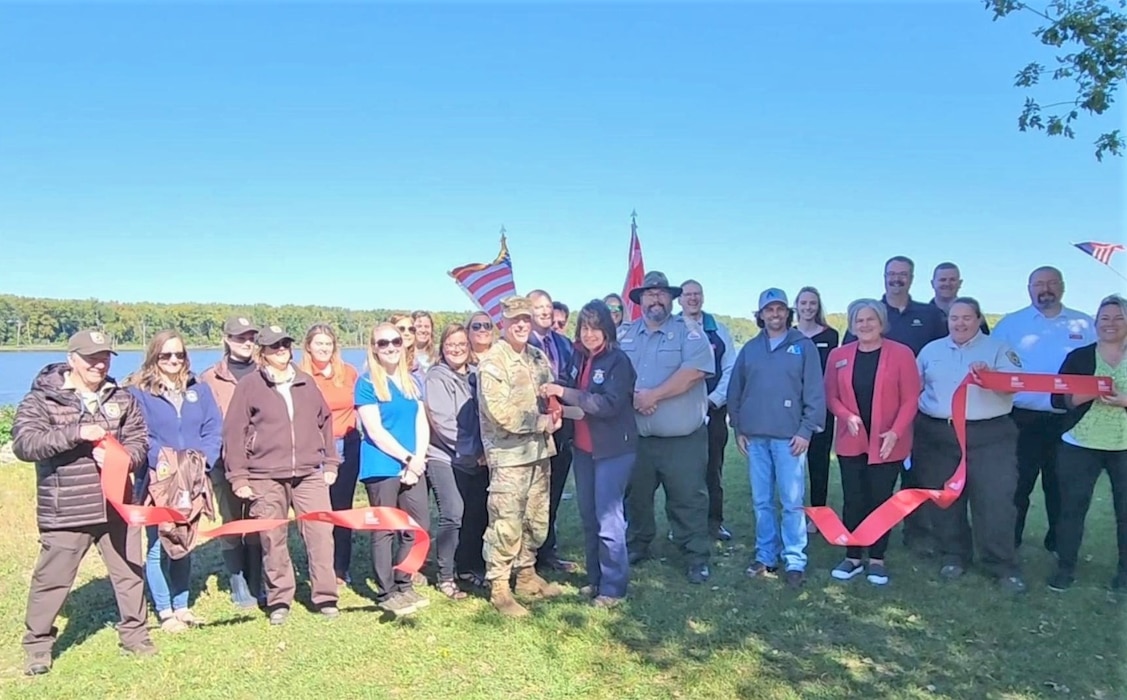 USACE Rock Island District Commander Col. Aaron Williams and Assistant Regional Director Lori Nordstrom from the U.S. Fish and Wildlife Service cut a ribbon marking completion of the Beaver Island Habitat Rehabilitation and Enhancement Project.