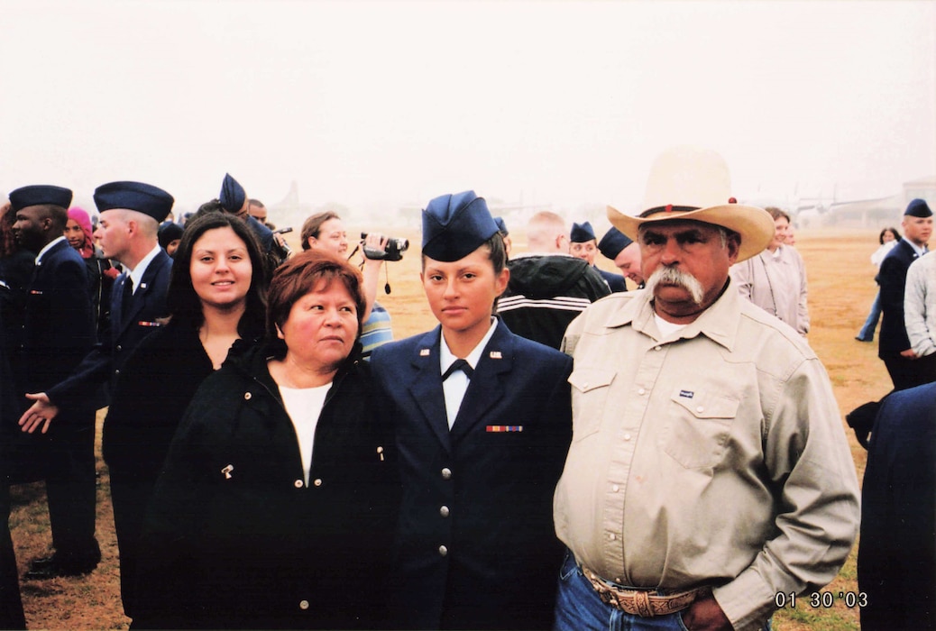 U.S. Air Force Airman Nancy Chavez Mozingo (center) poses for a photo with her family during her basic military training graduation at Lackland Air Force Base, Texas, Jan. 30, 2003. Service to family, community, and country are all strong values to Chavez Mozingo. (courtesy photo by Senior Master Sgt. Nancy Chavez Mozingo)