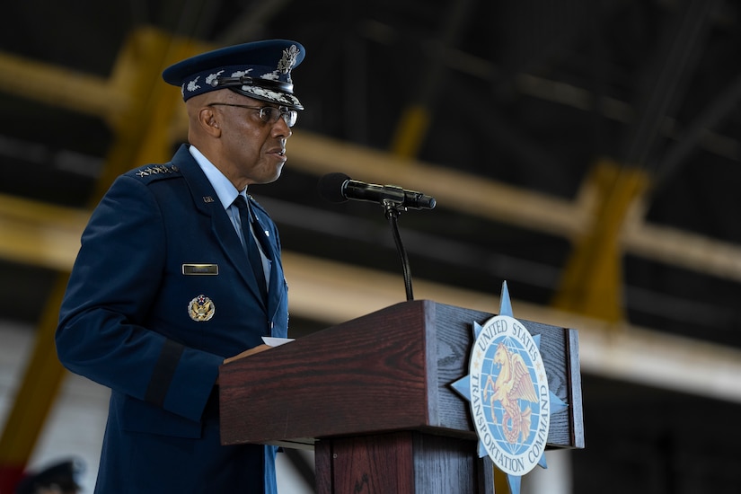 A government official speaks from behind a podium.