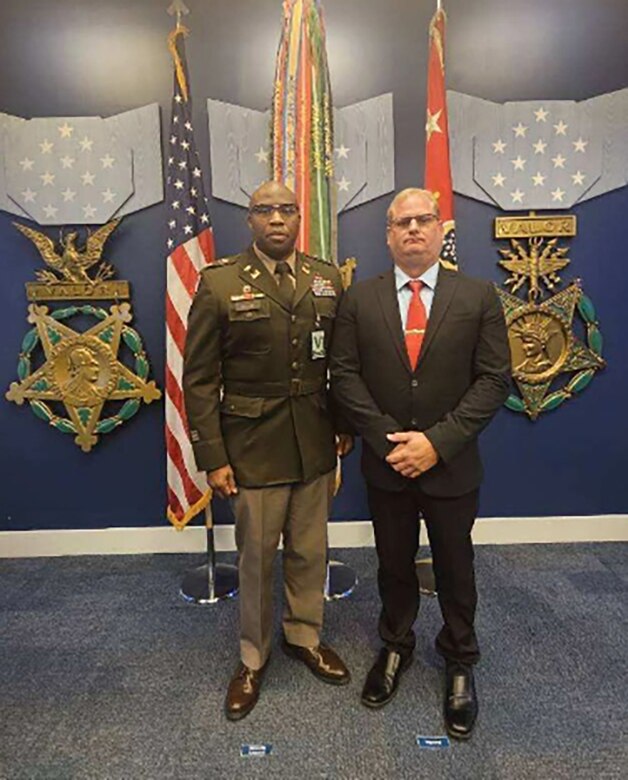 Lt. Col. Ike Ukachi, deputy commander for the U.S. Army Corps of Engineers Sacramento District, stands with Robert Chase, who was awarded the Secretary of the Army Award for Valor for his heroic actions to help rescue a man and his dog from an overturned vehicle last November. Secretary of the Army Christine Wormuth presented Chase, a senior fisheries biologist with the Sacramento District with the Award for Valor during a ceremony at the Pentagon on Sept. 5, 2024. (Courtesy Photo)