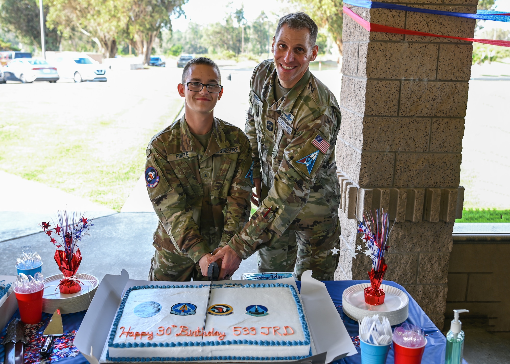 A Space Delta 1 senior enlisted leader and a 533rd Training Squadron student, cut a cake during the 533rd TRS 30th birthday at Vandenberg Space Force Base.