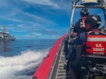 A boarding team from the USCGC Oliver Henry (WPC 1140), alongside a Palau Division of Marine Law Enforcement officer, return from a completed bilateral maritime law enforcement boarding on a foreign fishing vessel supporting the Republic of Palau in their Exclusive Economic Zone on Sept. 24, 2024. Their vigilance played a pivotal role in deterring illegal, unreported, and unregulated (IUU) fishing and other illicit maritime activities, thereby enhancing maritime security. (U.S. Coast Guard photo)