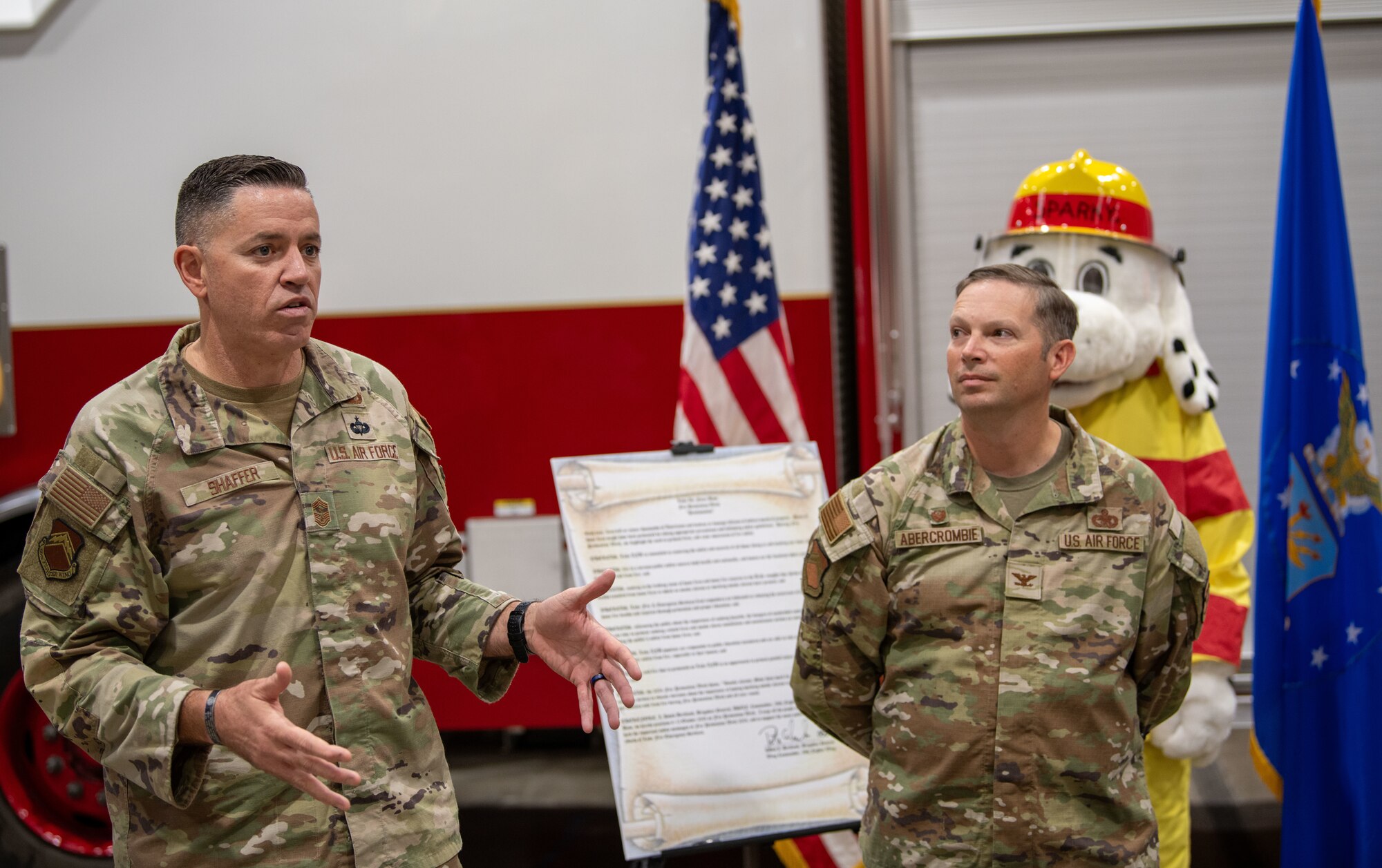 U.S. Air Force Airmen speak about the importance of fire safety in the fire station at Luke Air Force Base.