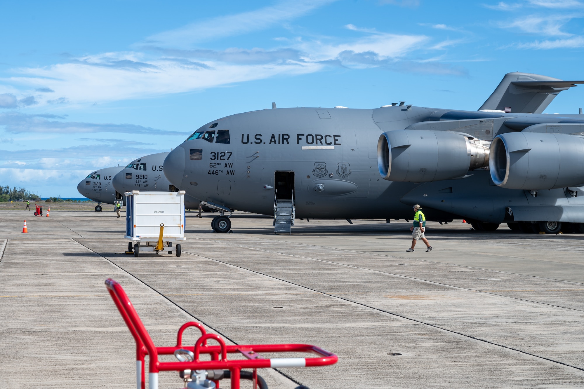 Three C-17 Globemaster IIIs sit lined up on the flightline at Kalaeloa, Hawaii, Oct. 4, 2024, during Exercise Rainier War 25A.