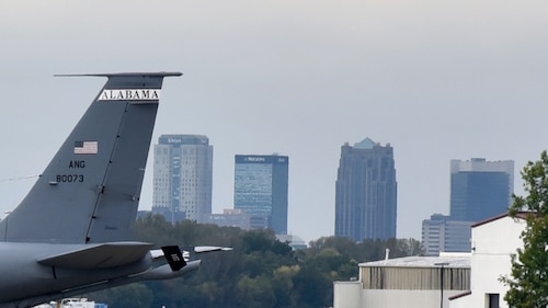 A U.S. Air Force KC-135 Stratotanker belonging to the 117th Air Refueling Wing sits parked on the flightline at Sumpter Smith Joint National Guard Base, Alabama, Oct. 13, 2023, with the Birmingham skyline in the distance. The 117 ARW’s mission is to provide quality worldwide air refueling, airlift, support, logistics, intelligence, and medical services in support of the greater Birmingham community, the state of Alabama, and the nation. (U.S. Air National Guard photo by Staff Sgt. Shelby Thurman)