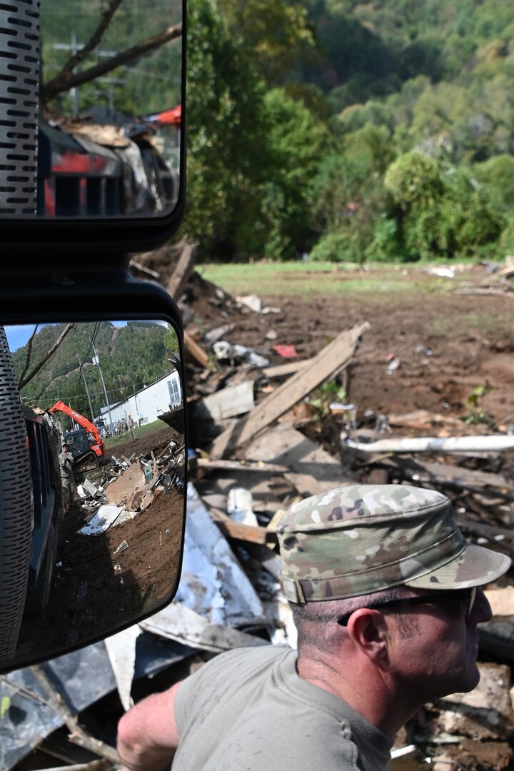 Tennessee Air National Guardsmen coordinating a convoy to the debris drop site in Hampton, Tennessee, on Oct. 2, 2024.