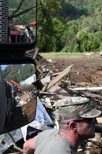 Tennessee Air National Guardsmen coordinating a convoy to the debris drop site in Hampton, Tennessee, on Oct. 2, 2024.