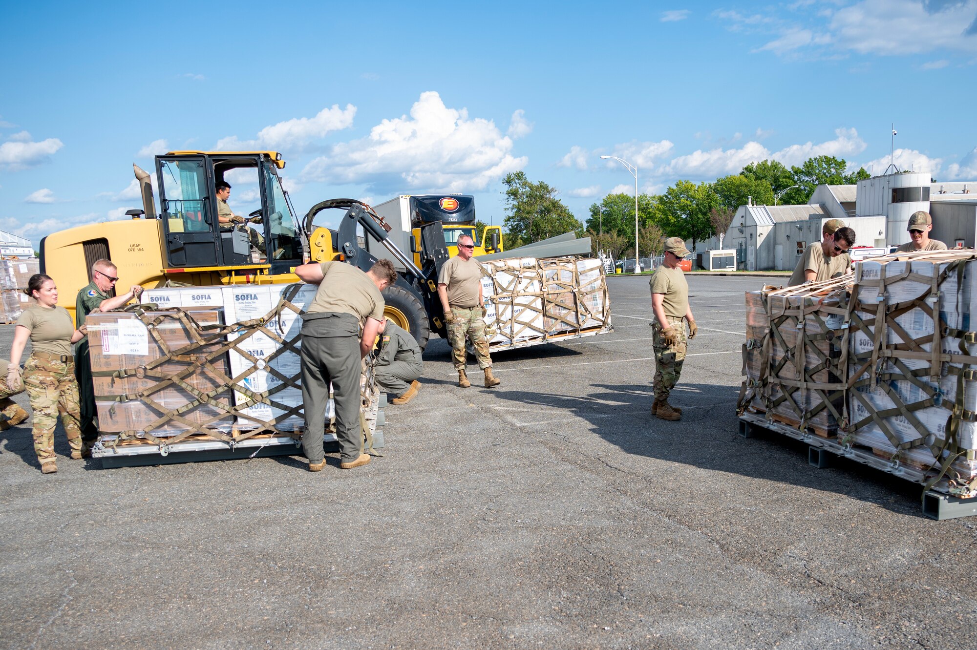 Members of the North Carolina Air National Guard palletize hurricane relief commodities for delivery to Western North Carolina in support humanitarian efforts following Tropical Storm Helene at the North Carolina Air National Guard, Charlotte-Douglas International Airport, October 3, 2024. The pallets delivered aboard a C-17 Globemaster III consisted of Meals Ready to Eat (MREs), water, medication and other vital supplies. (U.S. Air National Guard photo by Staff Sgt. Reanna Hartgrove)